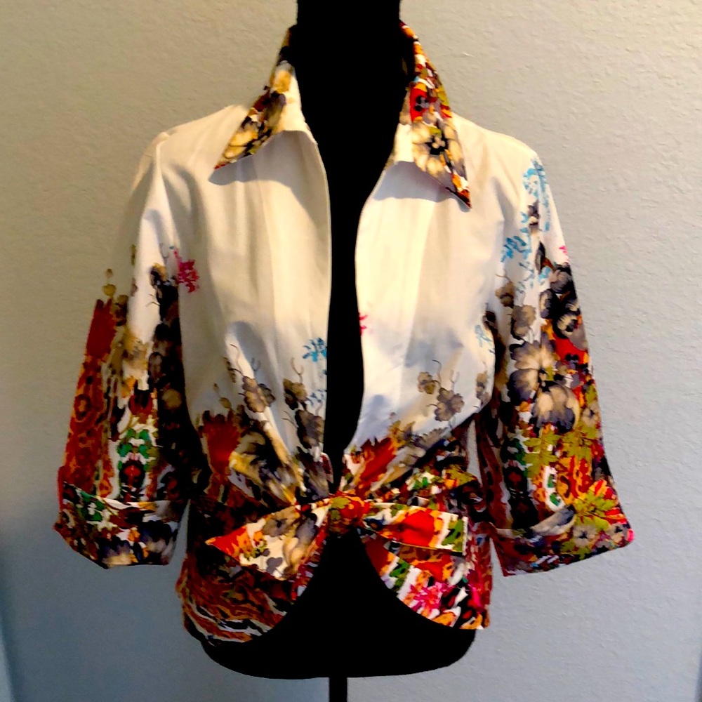Woman’s colorful front- tie over- blouse. Sz medium, new with tags. Excellent!
